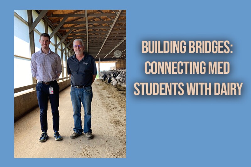 Fourth year med student Connor Fullerton visits with Iowa dairy farmer, Doug Stensland.