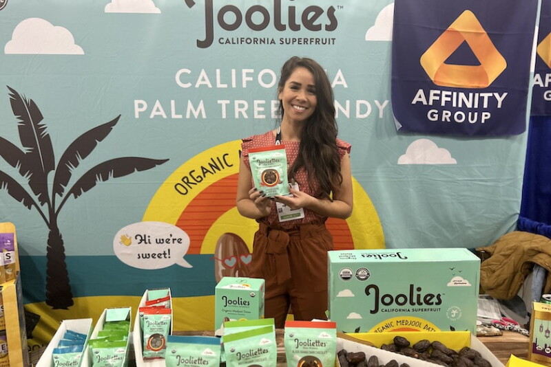woman holding dates pouch