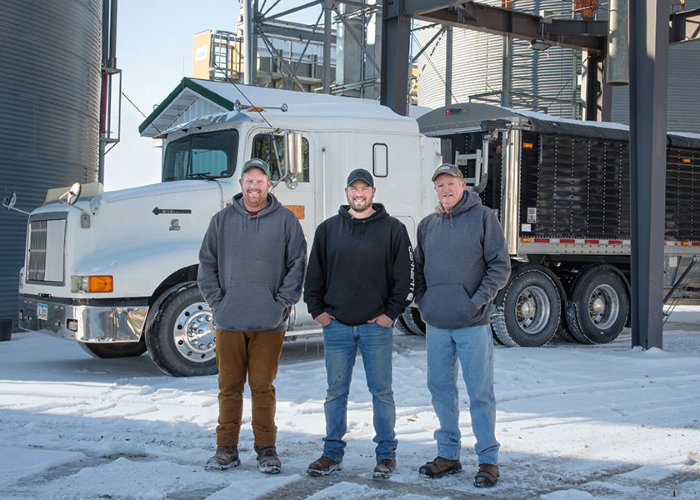 From left, brothers Andrew and Philip Hanna are combining their individual Iowa farm operations with their father, Mark. 