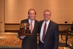 John Keeling (left), is the 2018 Potato Man for All Seasons, presented Jan. 11 by The Packer's editor Tom Karst. 