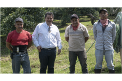 Carlos Genel Valencia (second from left) with workers from Rancho Agua Blanca.