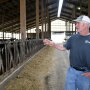 This April 11, 2019 photo shows dairy farmer Dwight Raber in Louisville, Ohio. Raber, of Raber Dairy Farms in northeast Ohio's Stark County says he can no longer make a living by milking cows and has lost money the last two years. State statistics show the number of dairy farms in Ohio dropped to fewer than 2,000. 