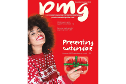 black woman in winter sweater holding tomato clamshell