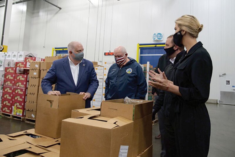 Maryland Gov. Larry Hogan (from left), Agriculture Secretary Sonny Perdue, Coastal Sunbelt Produce CEO John Corso, and Ivanka Trump tour a Coastal Sunbelt facility in Laurel, Md., on May 15. Perdue and Trump visited the facility to kick off the Farmers to Families Food Box Program.