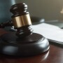 Photo of gavel and file in a courtroom