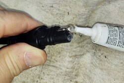 Dielectric grease lubricates and seals electrical connectors against moisture and dust.