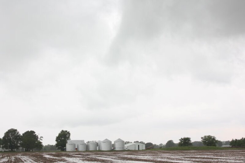 Corn and soybean prices saw pressure on Monday as recent rains in the Midwest weighed on the market. Wheat futures also traded lower, falling to the lowest level in more than a month. 