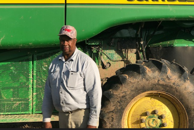 Mr. Conyer in front of Deere