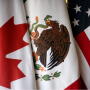 Flags are pictured during the fifth round of NAFTA talks involving the United States, Mexico and Canada, in Mexico City, Mexico on November 19, 2017.
