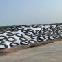 Pictured above is haylage pile that has been properly covered with tires touching, good slop and a sand berm around the base to hold it down and redirect water around the pile when it rains.