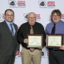 (l to r) Ben Schmaling, president of the Iowa Purebred Swine Council, presents the 2019 Master Seedstock Award to Bill Owens and Bob Owens.