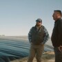 Wen Murphy and UC Davis Professor Frank Mitloehner next to anaerobic digester on a swine farm.