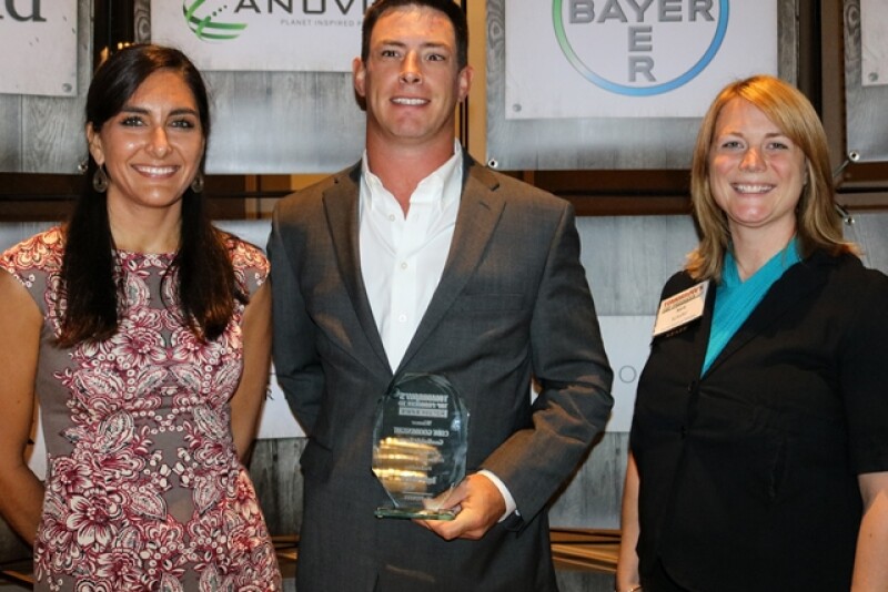 Cody Goodknight, a Chattanooga, Okla., cattle producer and row-crop farmer, accepts the 2017 Tomorrow’s Top Producer Horizon Award from DuPont Pioneer Marketing Communications Manager Katie Meyer (left) and Top Producer Editor Sara Schafer.