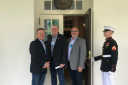 Three National Pork Producers Council members (l to r) —President and North Carolina producer David Herring,  Illinois producer Phil Borgic and Minnesota producer Randy Spronk—joined President Trump and USDA Secretary Perdue for the White House announcement. 
 