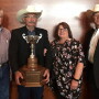 Drovers editorial director Greg Henderson (left) and BIF President Joe Mushrush (right) of Strong City presented the award to Kent and his wife, Jean. The award was sponsored by Drovers.  