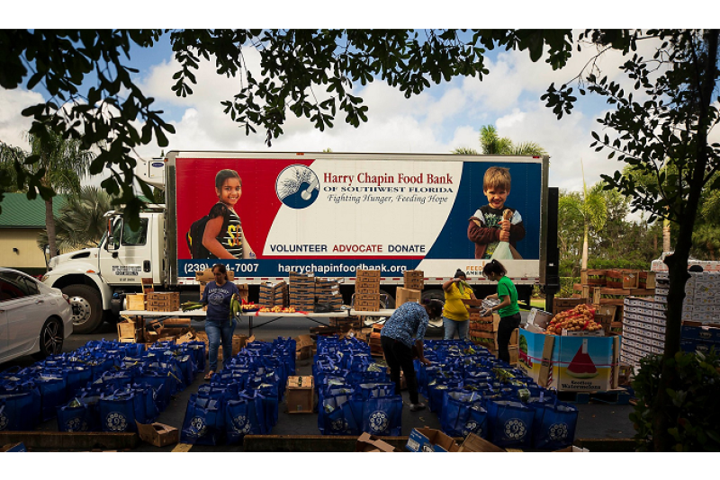 Volunteers at the Harry Chapin Food Bank of Southwest Florida prepare food packages with donated produce for distribution through Brighter Bites program in March. The company is seeking more donations in an effort meet