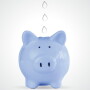 A blue piggy bank with water droplets
