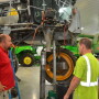 Paul Klein (left, red shirt) and Joe Klein (right, gray shirt) work employees to make sure everyone is understood.