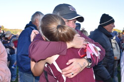 Olivia Shike and Coach Kara Leaman after State Cross Country Meet