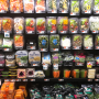 An assortment of pre-cut and packaged produce on a store's produce shelves