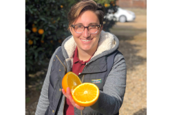 Bianca Kapreilian, CEO and co-founder of Fruit World, Reedly, Calif., with a navel orange.