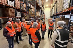 Participants in the International Fresh Produce Association’s Produce Safety Immersion Program tour a produce operation during a class trip to Chicago. 