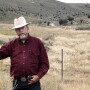 This Nov. 1997 file photo, rancher Wayne Hage, a longtime Sagebrush Rebellion figure who died in 2006, is shown in the area where federal agents seized 100 head of his cattle in 1991, in Meadow Canyon near Tonopah, Nev.
