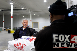 A Kansas City television station interviews Haun Potato Co. owner Dave Haun Dec. 12, at the annual potato donation he spearheads.