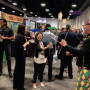 Soo Choi of Rainier Fruit Co., Selah, Wash., attempts to balance plates on sticks as part of the Mardi Gras-themed festivities at Southeast Produce Council’s Southern Exposure trade show Feb. 27-29 in Tampa, Fla.