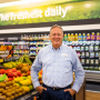 steve williams stands in produce department of a grocery store