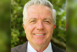 Portrait headshot of a man smiling