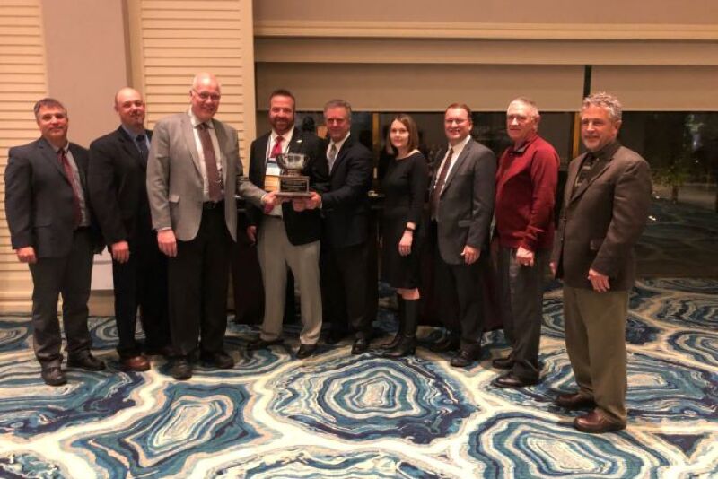 The NPC executive search committee receives The Packer’s 2019 Potato Men and Women for All Seasons Award on Jan. 16 from Packer Editor Tom Karst (center).