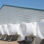 Barn exterior with ventilation tunnels.