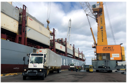 Containers are offloaded from Fresh Del Monte Produce Inc.’s Del Monte Spirit as the energy-efficient vessel makes its Jan. 9 inaugural call at Port Manatee.