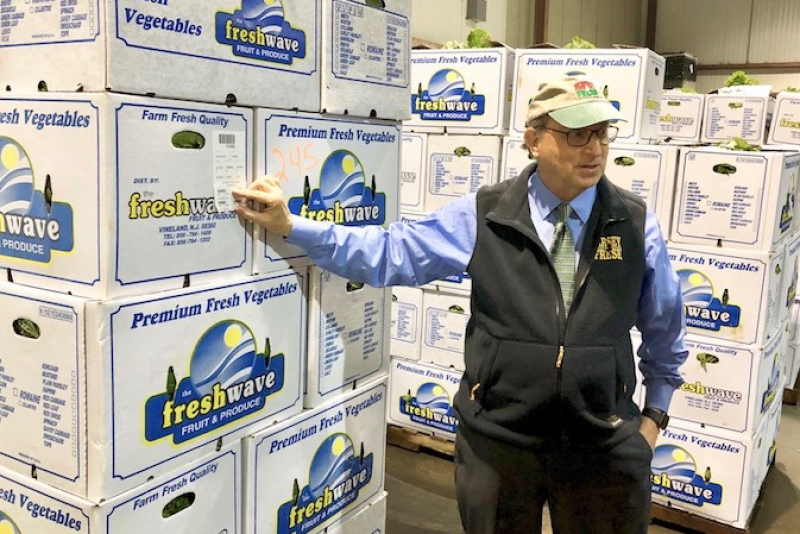 New Jersey secretary of agriculture Douglas Fisher points out the traceability label on FreshWave boxes of produce. The label is yet another example of efforts to increase food safety and traceability.