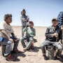 This June 13, 2017, photo shows workers from Guerrero state in Mexico taking a break after clearing rocks from Mexican farmer Pedro Suderman's fields just south of the U.S.-Mexico border.