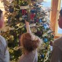 Johnson kids decorating the Christmas tree