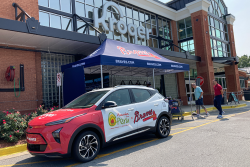 The AVO Braves Chevrolet Bolt EUV is shown Aug. 19 in front of the Kroger store on Sugarloaf Parkway in Duluth, Ga. 