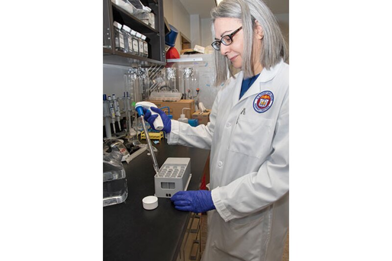 A scientist on the FDA’s Foodborne Parasitology Research Team works on a test for detecting foodbor