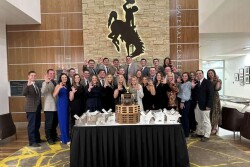 Kstate meat eval team standing with trophy