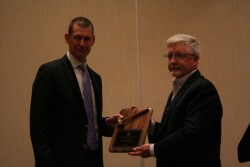 Dr. Brad White (left) passes the gavel to new AVC president K. Shawn Blood.