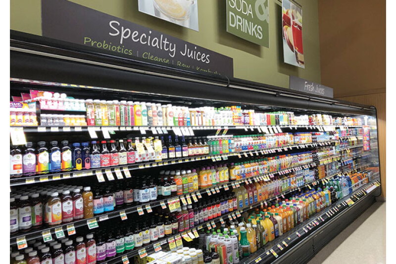 The juice and specialty beverage display at an Albertsons location.
