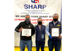 Carlos Bon (from left), vice president of sales at Divine Flavor; Jose Antonio Martinez, general manager; and Alan Aguirre, president and CEO, at a ceremony celebrating the company's health and safety management systems.