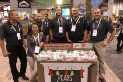 Rainier Fruit had a big presence at the Produce Marketing Association's Fresh Summit expo. Randy Abhold, president of Rainier Fruit, Selah, Wash., (far right), said there are plenty of strong apple promotion opportunities, starting now.