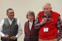 Past SRM President Dr. J. Alfonso “Poncho” Ortega listens as Chuck Jarecki and his wife, Penny, present their original concept for the award.