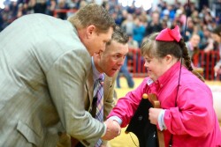 The crowd roared as judges Ryan Sites (left) and Brandon Yantis awarded Samantha Iselt the grand champion barrow overall award at the 2020 San Antonio Stock Show and Rodeo. 